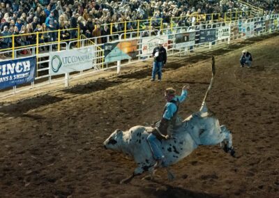 man riding a bull during the Sisters Rodeo 2019