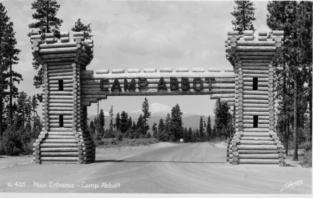 A historic photo of an arch welcoming visitors to Camp Abbot, now Sunriver, Oregon, circa 1943. A historic photo of an arch welcoming visitors to Camp Abbot, now Sunriver, Oregon, circa 1943.