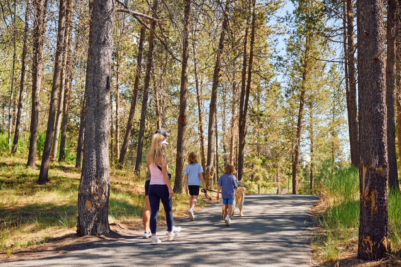 Family walking on the paved paths in Sunriver, Oregon. Family walking on the paved paths in Sunriver, Oregon.