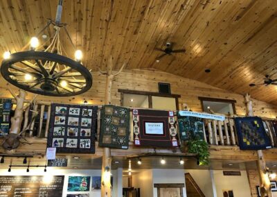 beautiful handmade quilts hung around Sisters Coffee Company