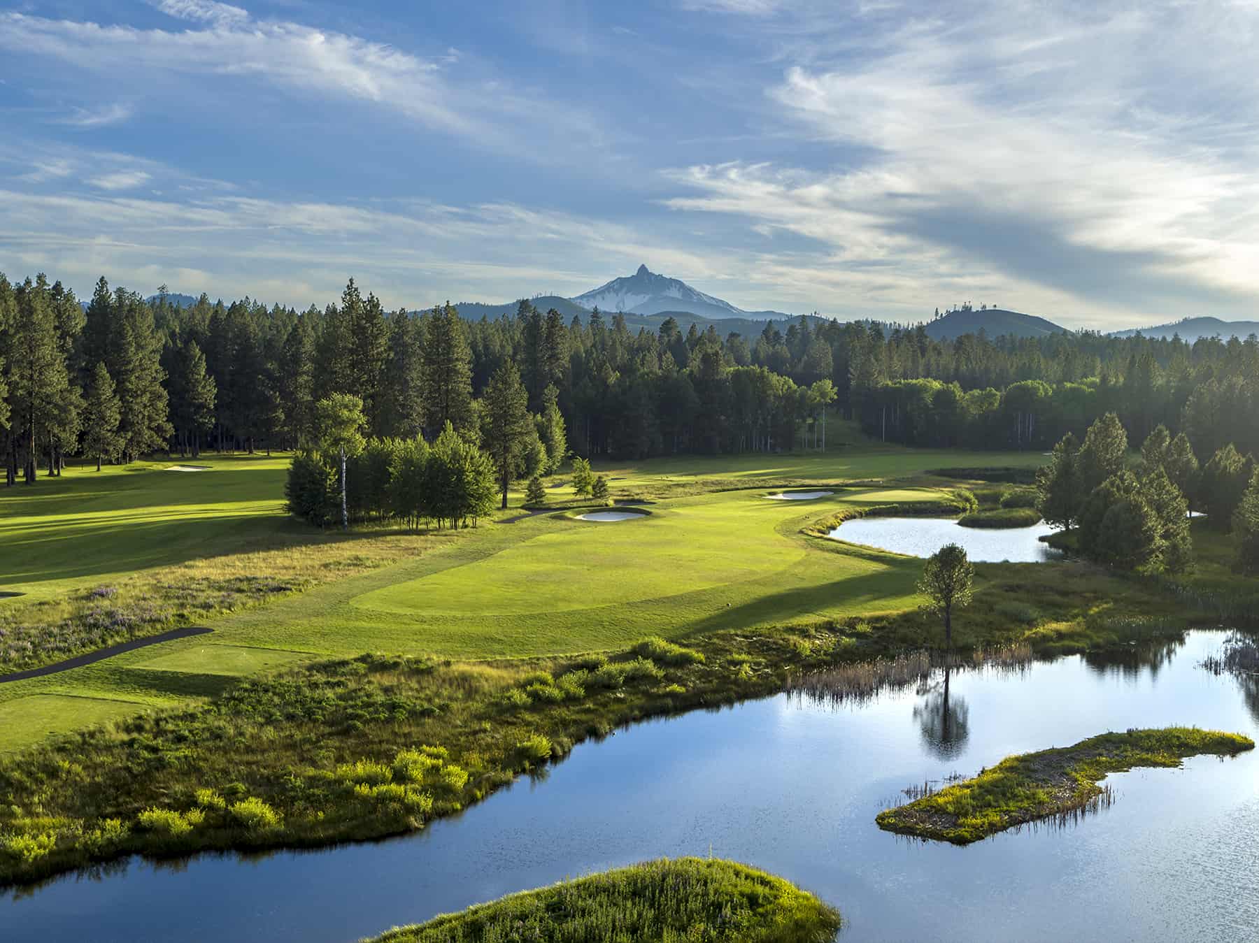 Mount Washington looms over the Glaze Meadow golf course at Black Butte Ranch in Sisters, Oregon.