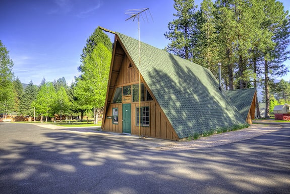 An A-frame cabin stands at the entrance of the Camp Sherman RV Park & Motel in the Metolius River Basin.