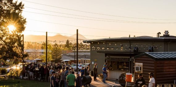 A crowd enjoys the outdoor area at Crux Fermentation Project in Bend, Oregon. A crowd enjoys the outdoor area at Crux Fermentation Project in Bend, Oregon.