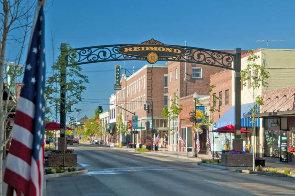 Downtown Redmond, Oregon welcomes visitors with a wrought-iron arch on Sixth Street.