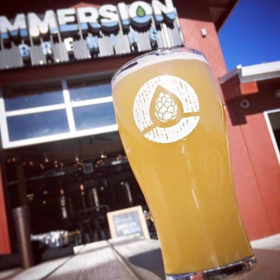 A pint of beer sits on a table in front of Immersion Brewing in Bend, Oregon. A pint of beer sits on a table in front of Immersion Brewing in Bend, Oregon.