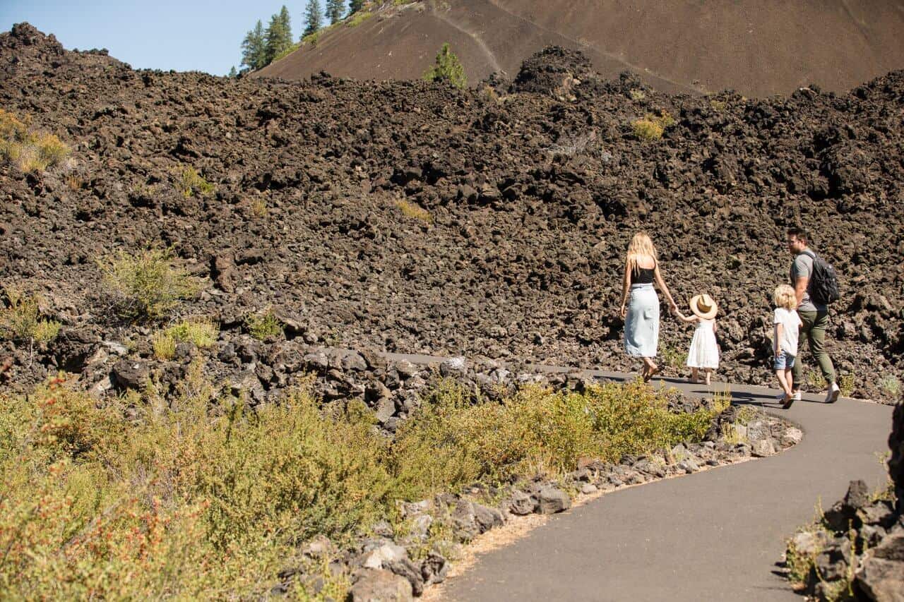 A family walks through the lava lands. A family walks through the lava lands.