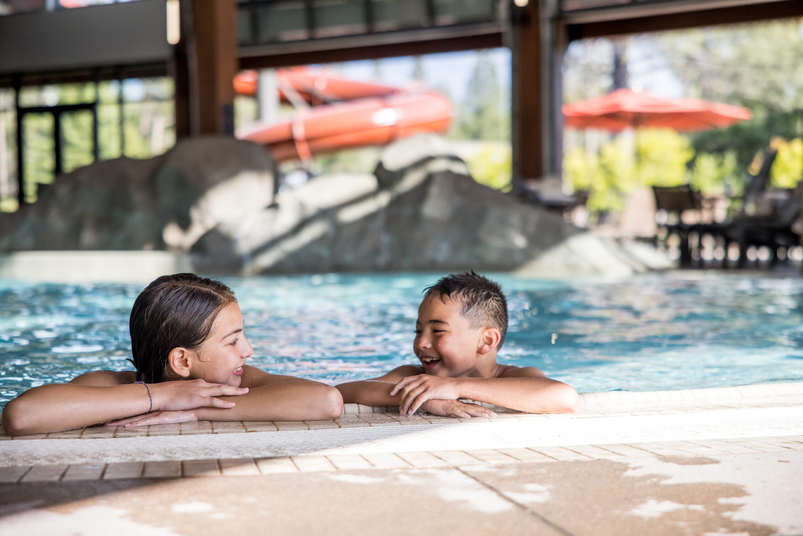 Kids swimming at indoor swimming pool. Kids swimming at indoor swimming pool.