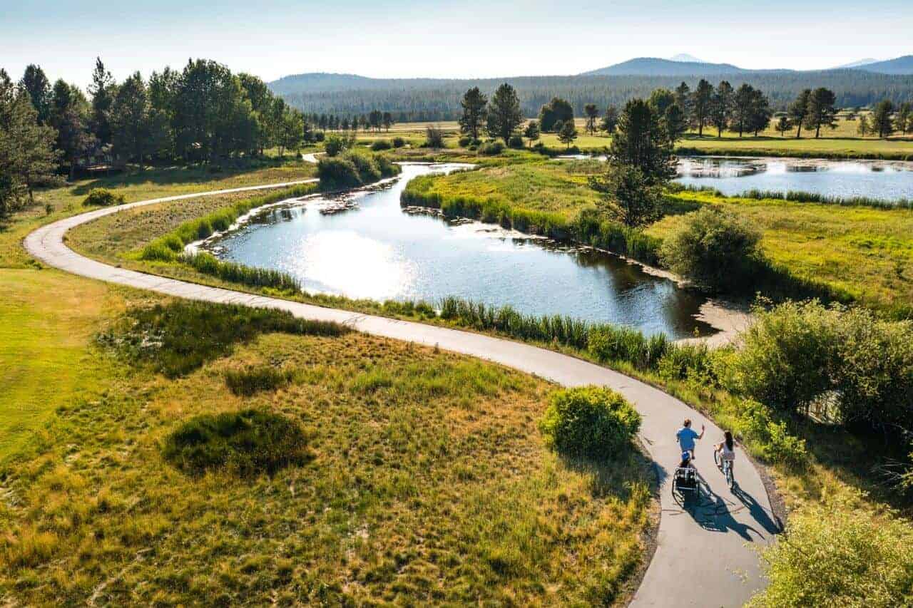 Two people enjoy the bike trails at Sunriver Resort. Two people enjoy the bike trails at Sunriver Resort.