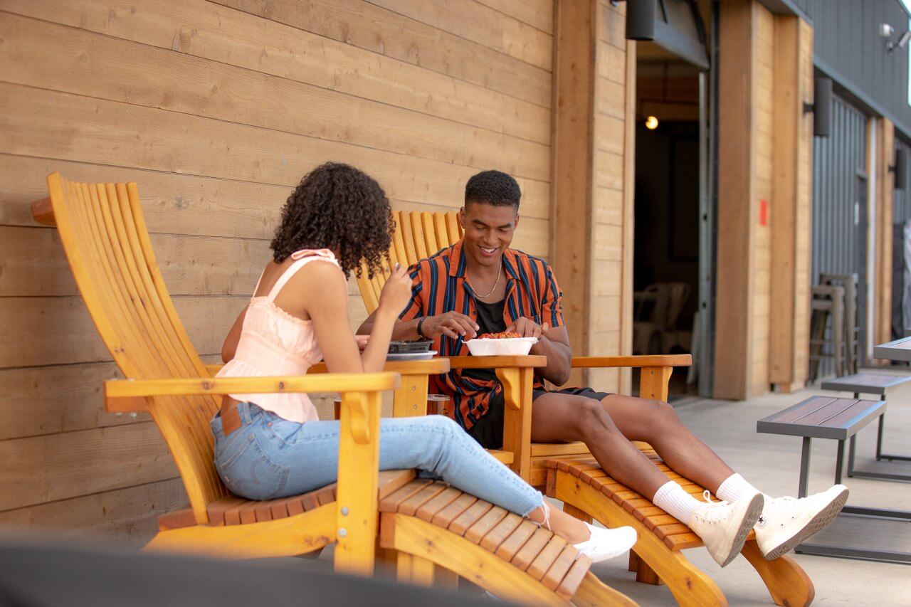 Couple enjoying food on the patio at General Duffy’s Waterhole. 