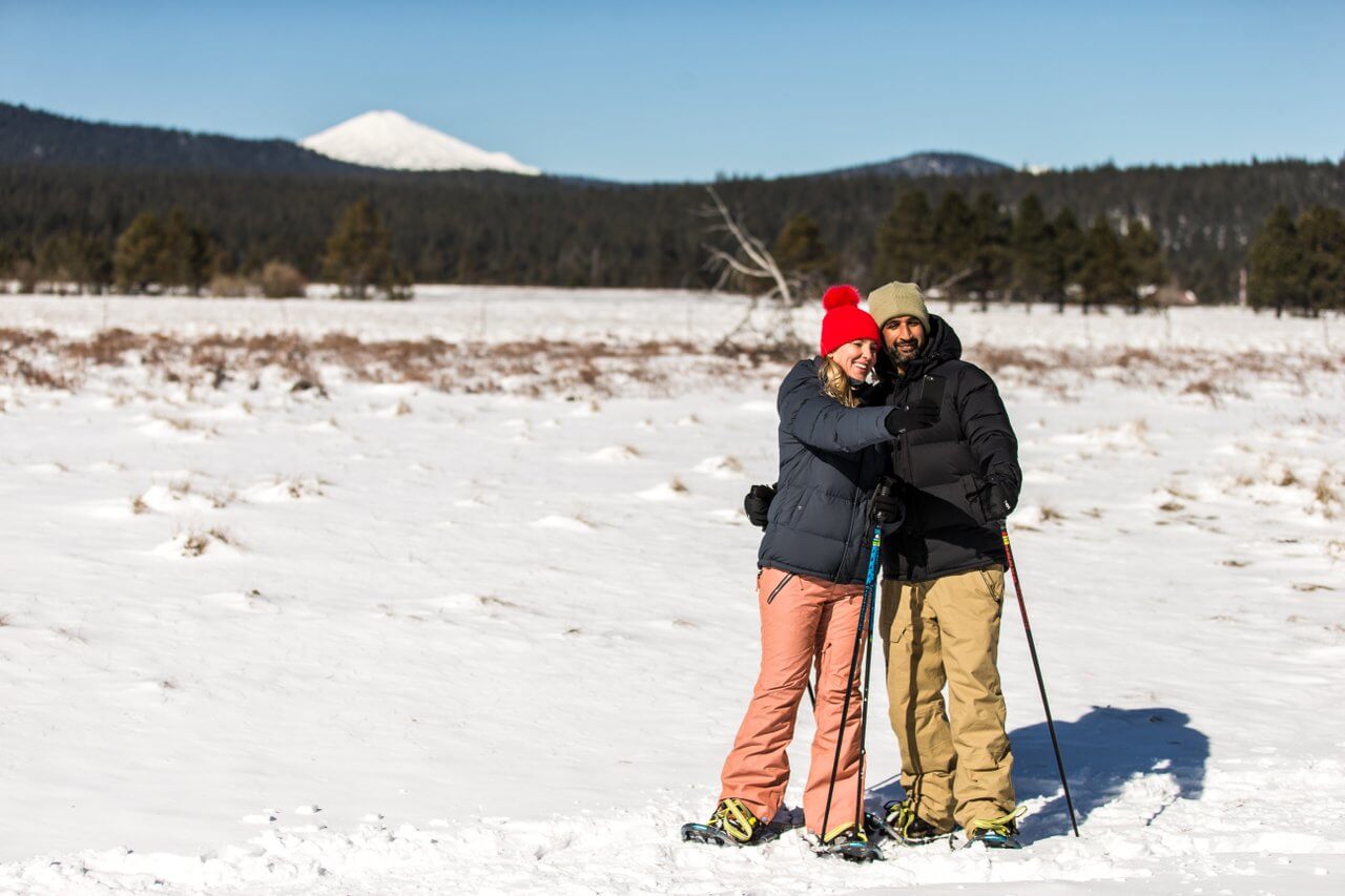 Couple snowshoeing in Sunriver, Oregon Couple snowshoeing in Sunriver, Oregon