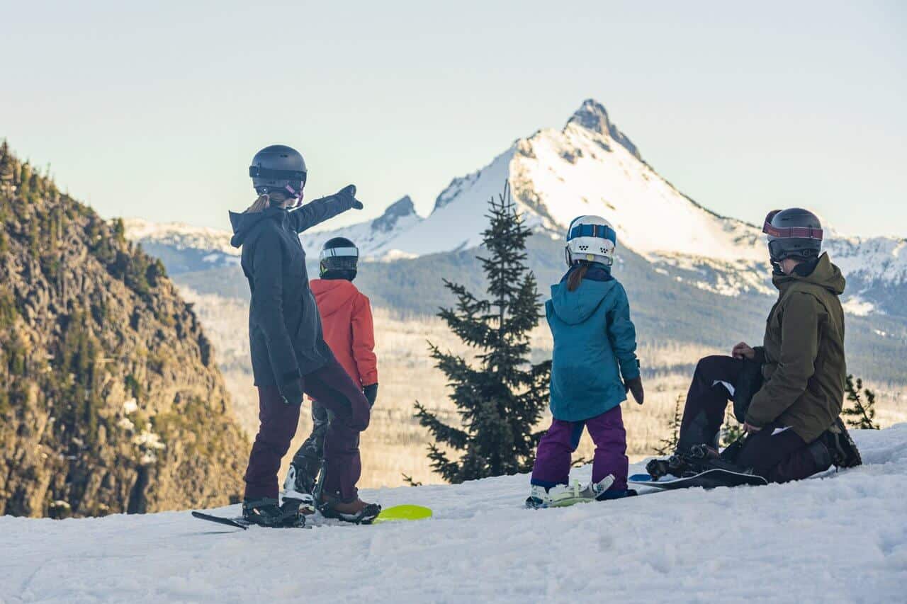A family looks over mountain views at Hoodoo Ski Area. A family looks over mountain views at Hoodoo Ski Area.